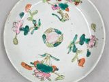 a white plate with flowers on it on a table