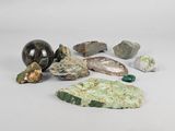 a lot of different rocks and stones on a white surface
