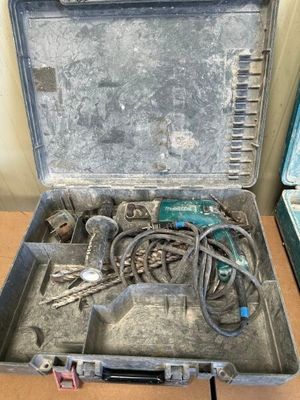 a metal case with tools in it sitting on a table