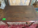 a small table with a green label on it