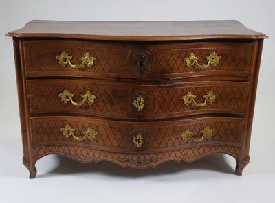 a wooden chest of drawers with gold handles on it