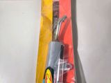 a package of tools sitting on a table next to a door