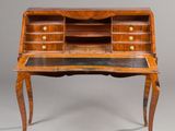 an antique writing desk with two drawers and a marble top