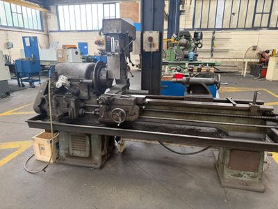 an image of a large machine in a factory with a lot of machinery