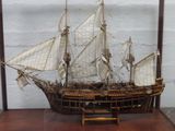 a model of a sailboat on display on a table