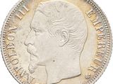 a close up of a coin with a man ' s face on it