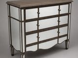 a dresser with mirrored drawers and a wooden top