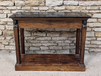 a wooden table with a marble top on it