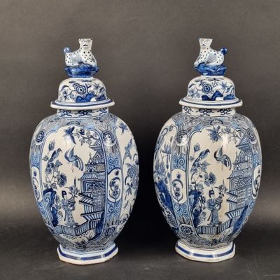 pair of blue and white vases with birds on them