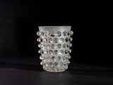 a glass vase that is sitting on a table