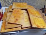 several pieces of wood are stacked on top of each other on a table