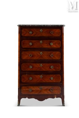 an antique chest of drawers with marble top