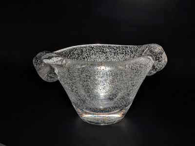 a glass bowl that is sitting on a table