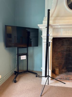 a fireplace and a television in a room with blue walls