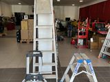 a ladder that is sitting in the middle of a room