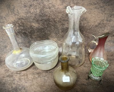 many glass vases that are sitting on a table
