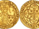 a gold coin with an image of a woman holding a cross