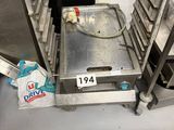 an image of a conveyor belt with a tray of doughnuts