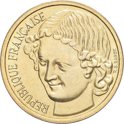 an image of a close up of a coin with a woman ' s face on it