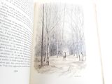 an open book with a picture of a person walking in the woods