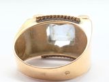 an image of a gold ring with a clear stone in the middle