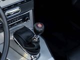 a close up of a car dashboard with a gear stick