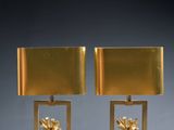 pair of brass table lamps with flowers and leaves on them