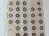 a lot of coins in a plastic bag on a table