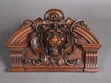 an image of a wooden sculpture of a lion with a lion ' s head on it