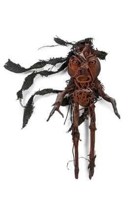 an image of a sculpture of a man made out of wood