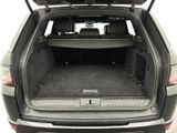 the back of a black suv with its trunk open