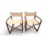 pair of folding chairs made of bamboo and leather
