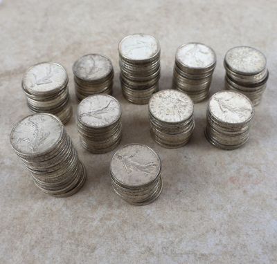 a lot of coins sitting on the floor next to each other