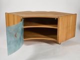 a small wooden cabinet with a door open