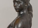 statue of a woman with a bird on her head