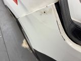 a close up of a white car with a red star on the side
