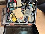 a box full of assorted items sitting on a table