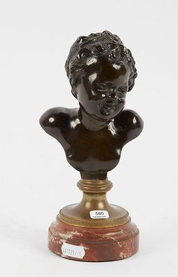 a bronze bust of a boy on a marble base