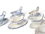 many different types of porcelain dishes and saucers