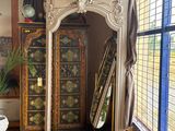 a large mirror in the corner of a room