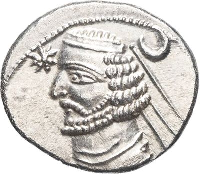 a close up of a coin with a man ' s face on it