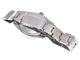 an image of a close up of a wrist watch on a white surface