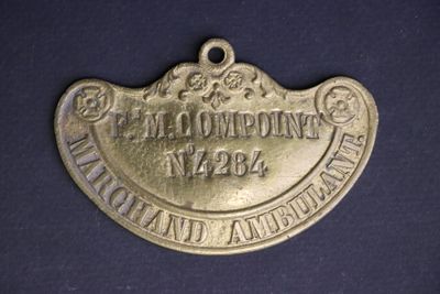 an old brass plate with the name of a company