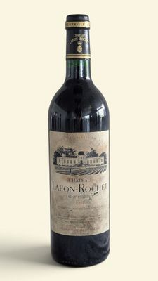 a bottle of wine that is sitting on a table