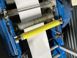 a machine that has a roll of paper on it