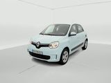 the light blue car is parked in a white room