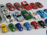 a lot of toy cars that are lined up together
