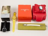 a box with a watch, a watch case, a watch and a watch in it