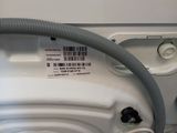 a washing machine with a hose attached to it
