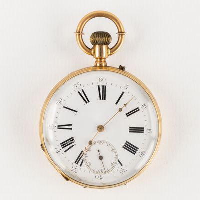 une montre de poche ancienne en or, avec des chiffres romains sur le cadran